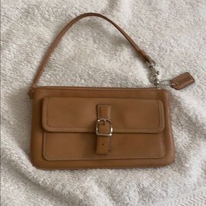 Tan Coach wristlet.